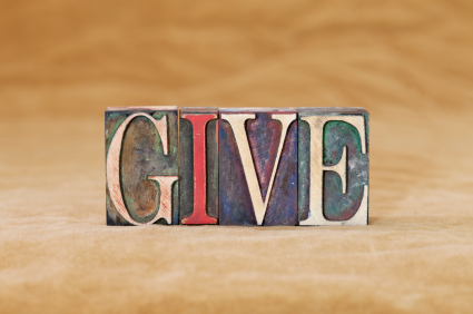 wooden blocks spelling out the word Give